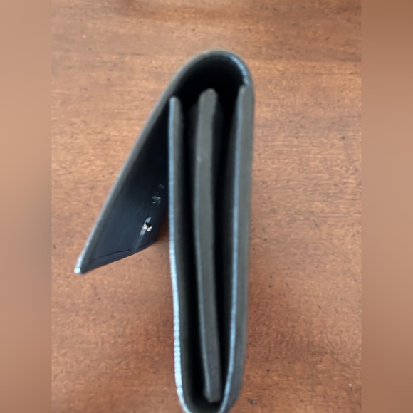 Salvatore Ferragamo black long snap wallet.
Excellent condition. - Picture 7 of 9